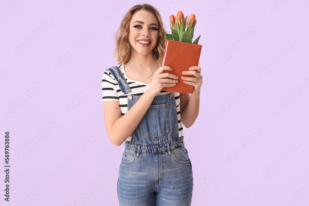 Beautiful happy young woman with bouquet of tulips and book on lilac background Beautiful happy young woman with bouquet of tulips and book on lilac background