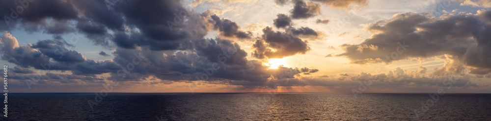 Fototapeta premium Dramatic Colorful Sunset Sky over Mediterranean Sea. Clouds with Sunrays. Cloudscape Nature Background. Panorama