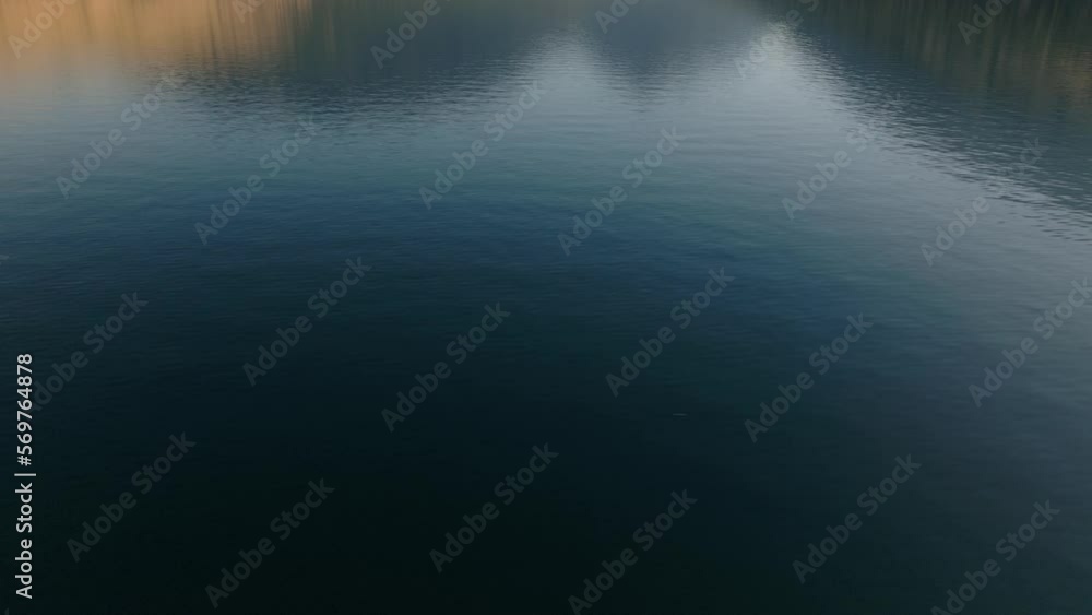 Aerial tilting up to show reflection of mountains on alpine Wallowa Lake Aerial tilting up to show reflection of mountains on alpine Wallowa Lake