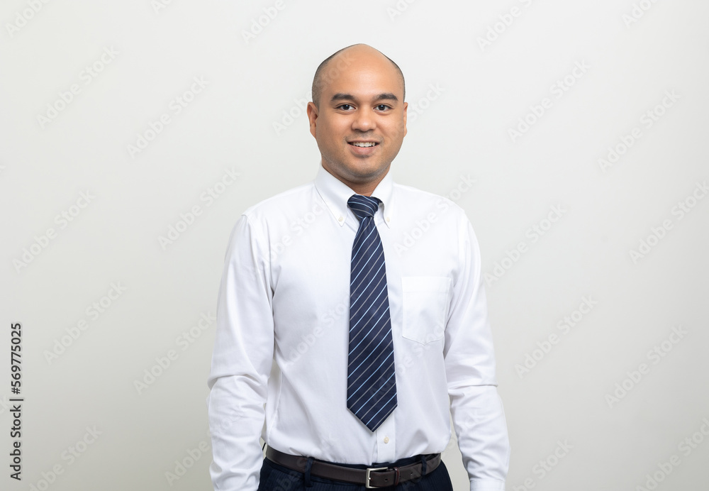 Portrait of Young asian businessman on isolated white background. Handsome middle aged Indian businessman in office uniform. Portrait of Young asian businessman on isolated white background. Handsome middle aged Indian businessman in office uniform.
