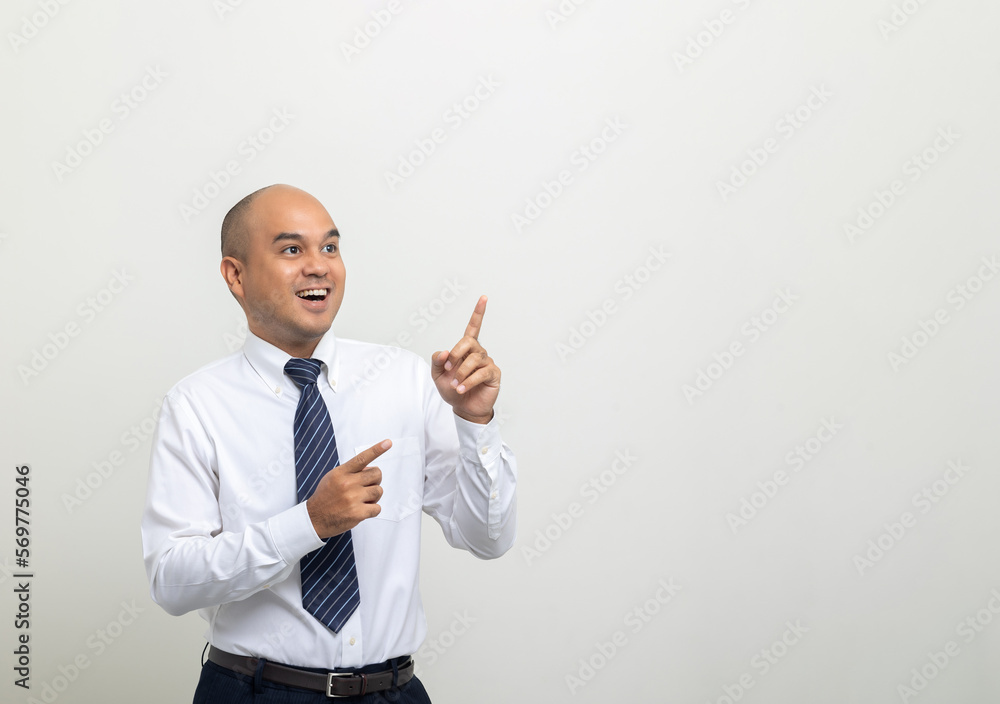 Pointing finger to blank space. Young asian businessman on isolated white background. Handsome middle aged Indian businessman in office uniform. Pointing finger to blank space. Young asian businessman on isolated white background. Handsome middle aged Indian businessman in office uniform.