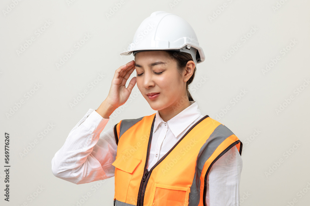 Asian engineer worker woman or architect with white safety helmet standing on isolated white background. Feeling depressed stress headache be tired from working health problems