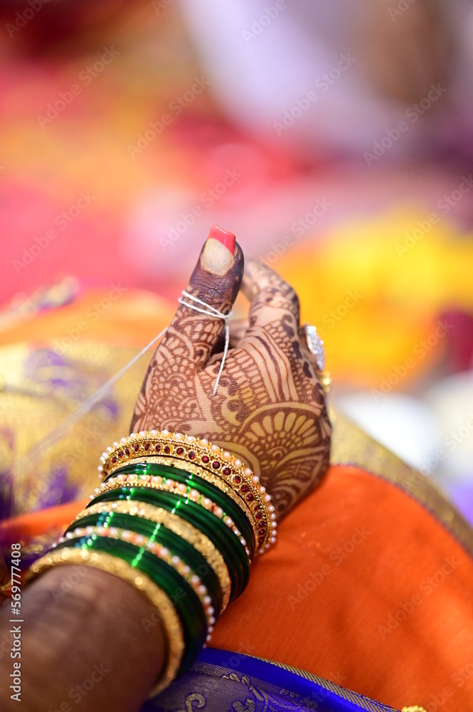 White thread around finger of Indian Bride in wedding ceremony. Maharashtra traditional wedding