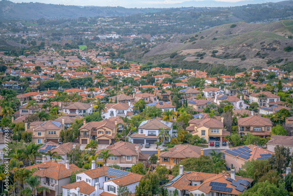 Large houses in a wealthy neighborhood near the hiking trail at San Clemente, California. View from a hiking trail of a neighborhood near the mountain slopes.