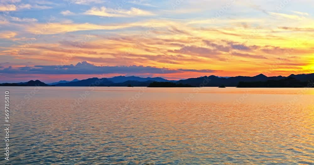 Beautiful lake and mountain with colorful sky clouds at sunset in Hangzhou, Zhejiang Province, China. Beautiful lake and mountain with colorful sky clouds at sunset in Hangzhou, Zhejiang Province, China.