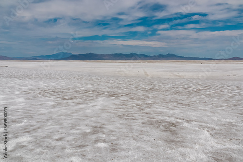 Scenic view of Bonneville Salt Flats in western Utah with Silver Island Mountains peaks in the background, Wendover, USA, America. Densely packed salt pan and natural landscape near Salt Lake City