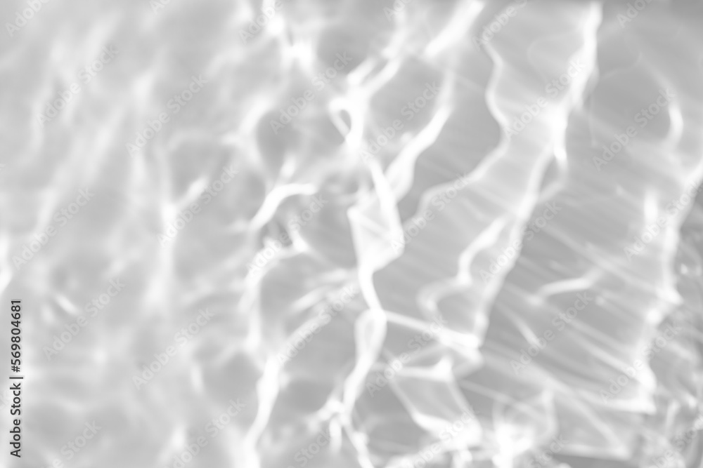 Blurred defocused water texture overlay effect for photo and mockups. Organic drop diagonal shadow and light caustic effect on a white wall. Shadows for natural light effects Blurred defocused water texture overlay effect for photo and mockups. Organic drop diagonal shadow and light caustic effect on a white wall. Shadows for natural light effects