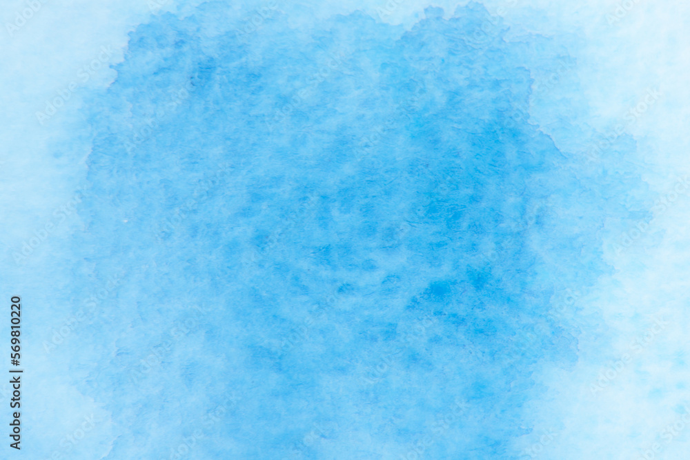 Blurred image of watercolor, blue, streak gradient color combinations on drawing paper, used as a background.