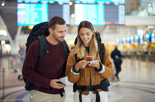 Canvas Print Happy couple, airport and phone with ticket, travel app and adventure with excited face, conversation and smile