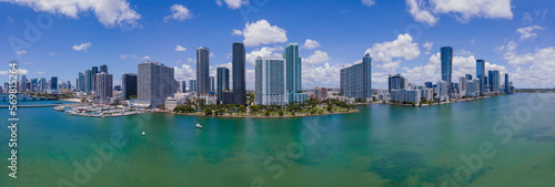 Intracoastal Waterway and Miami Beach Florida against blue sky and clouds. Beautiful scenery of inland water channel with modern buildings in Miami skyline.