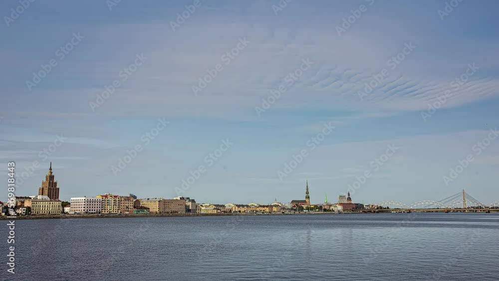 Daugava river and skyline of Riga city with traffic, fusion time lapse Daugava river and skyline of Riga city with traffic, fusion time lapse