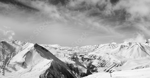 Black and white panorama of winter snowy mountains