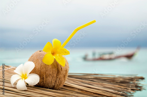 coconut with cocktail at the beach, Koh Lipe, Thailand photo