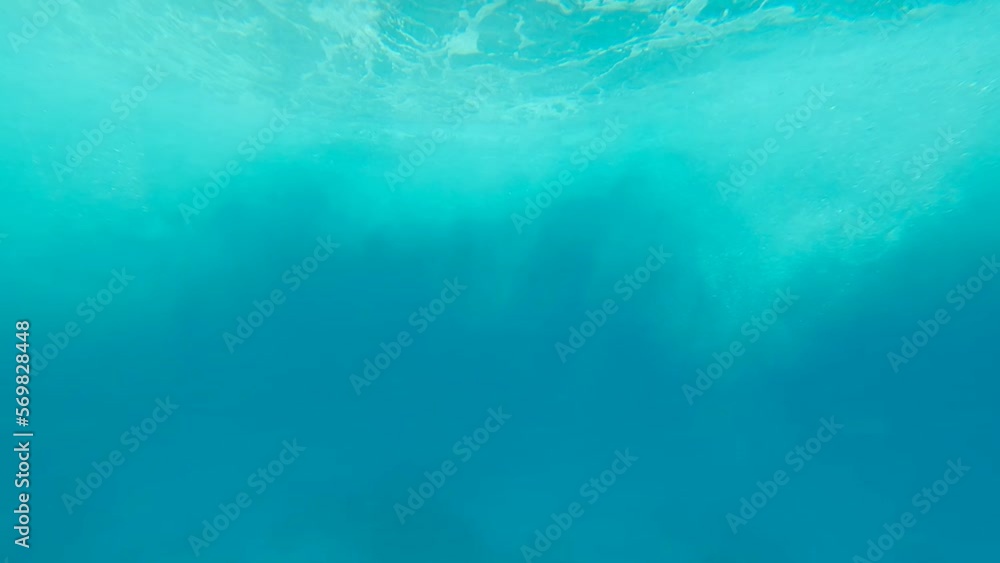 Disturbed Sea Water Surface From the Window of a Boat. Blue Under Water Texture Sea Ocean. Rough Underwater Ocean With Bubbles. Sea Water Behind a Running Ship Disturbed Sea Water Surface From the Window of a Boat. Blue Under Water Texture Sea Ocean. Rough Underwater Ocean With Bubbles. Sea Water Behind a Running Ship