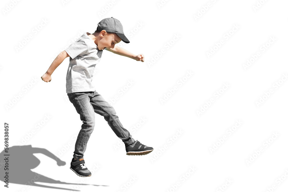 a Young boy runs in the jump on the street on a bright blue background - obrazy, fototapety, plakaty 