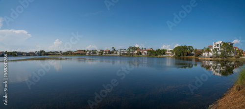 Single-family homes with Four Prong Lake views at Destin, Florida. Lakefront houses against the clear blue skyline at the background.