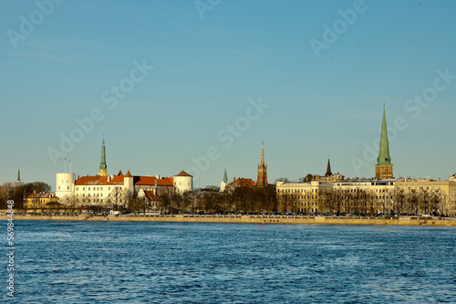 riga, panorama of the city, in the background the blue sky in the foreground is the river