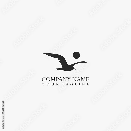 Flying seagull silhouette logo simple and minimalist.