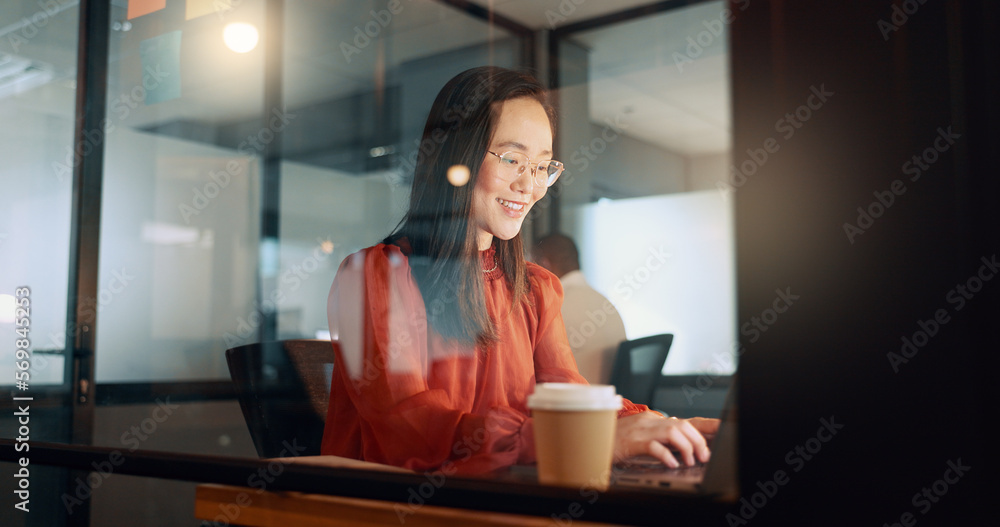 © Nicholas F/peopleimages.com - Laptop, night office and Asian woman typing email, sales proposal or finishing project deadline. Computer, tech and happy female employee working late in dark workplace, researching or writing report