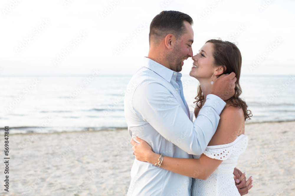 romantic couple embracing and looking at each other smiling romantic couple embracing and looking at each other smiling