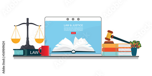 Law books with a judge s gavel and scales on laptop.