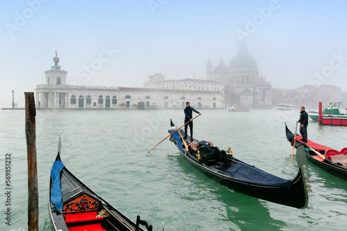 Venezia. Gondole in Canal Grande verso la Dogana e La Salute con foschia photo