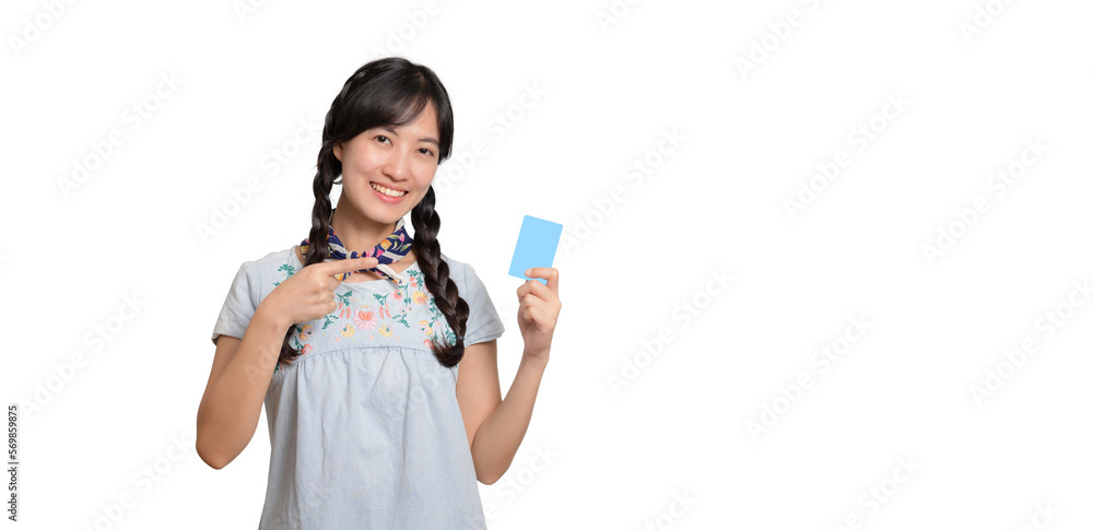 Portrait of beautiful happy young asian woman in denim dress holding credit card on white background Portrait of beautiful happy young asian woman in denim dress holding credit card on white background