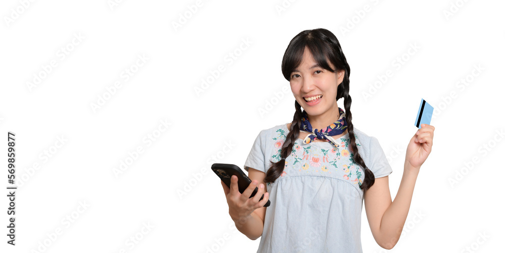 Portrait of beautiful happy young asian woman in denim dress holding credit card and smartphone on white background. studio shot Portrait of beautiful happy young asian woman in denim dress holding credit card and smartphone on white background. studio shot