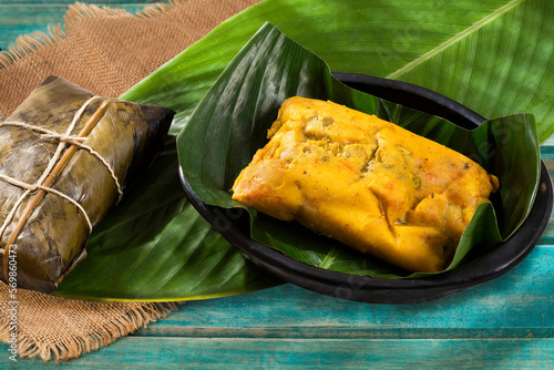 Tamale Typical Colombian Food Wrapped In Banana Leaves photo