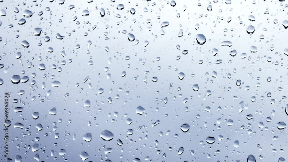 Raindrops on a window pane close-up Raindrops on a window pane close-up