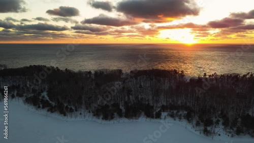 Slow pan across the horizon of lake Michigan during a Winter sunset. photo