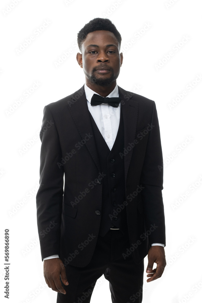Cool young positive african american man in classic elegant black suit on white background. Portrait of showman or presenter of festive event who smiles at camera. Cool young positive african american man in classic elegant black suit on white background. Portrait of showman or presenter of festive event who smiles at camera.