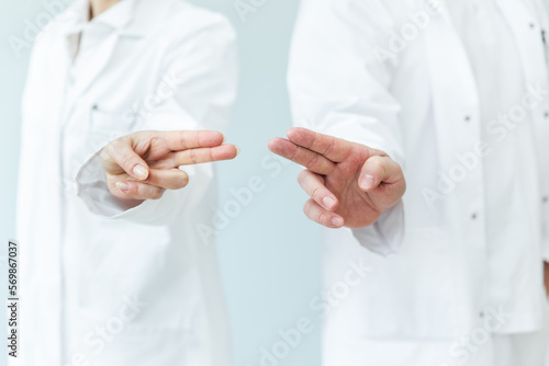 two doctors wiping with fingers, space for interactive themes