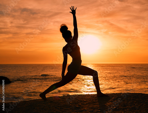 Yoga  exercise and silhouette of woman on beach at sunrise for fitness  training and pilates workout. Motivation  meditation and shadow of girl balance by ocean for sports  wellness and stretching