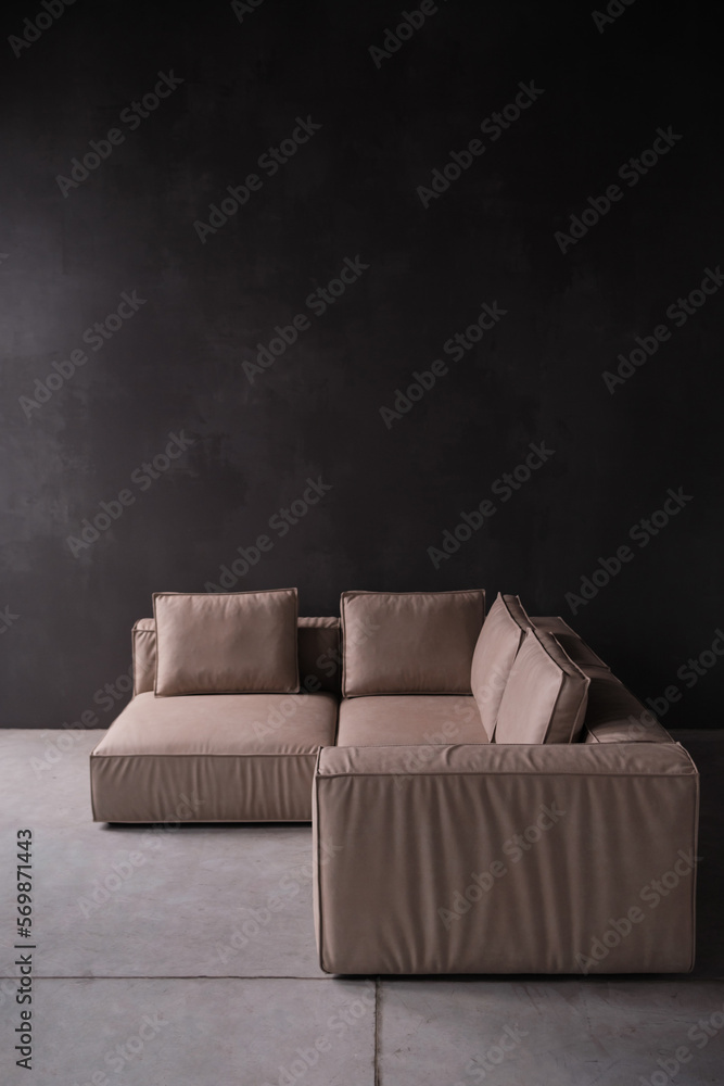 Interior of living room loft style with beige sofa with concrete wall on concrete white floor. Interior of living room loft style with beige sofa with concrete wall on concrete white floor.