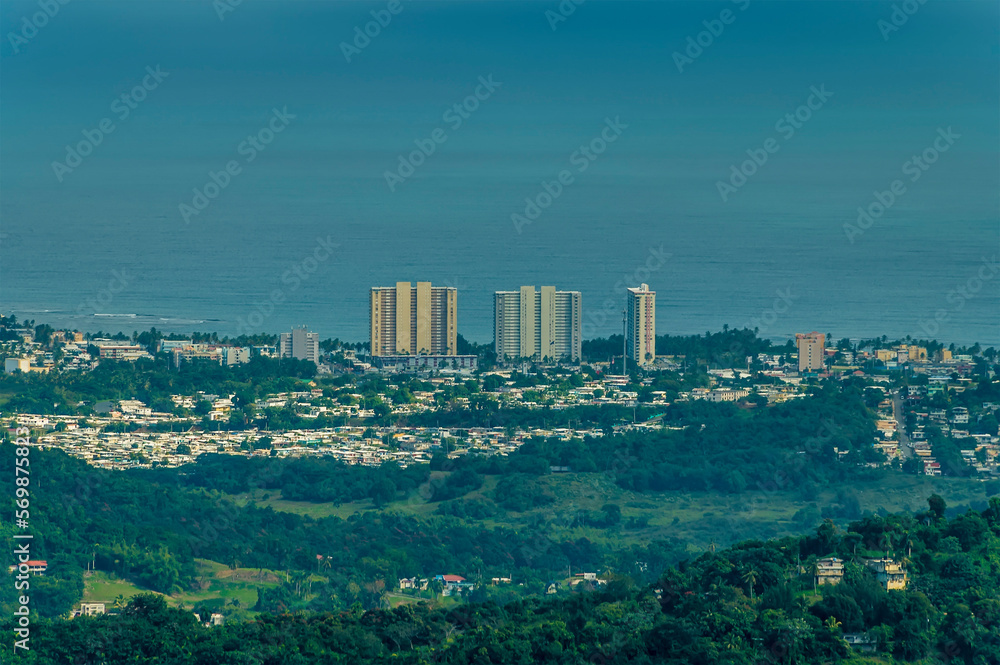 Obraz premium A view towards the coast from the tropical rainforest in Puerto Rico on a bright sunny day