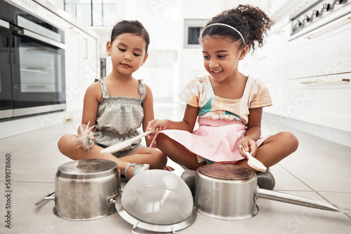 Photography Girl children are playing house, pots as drums and happy, care free at family home and make believe with music fun