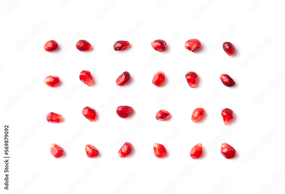 Pomegranate seeds are neatly arranged on a white background top view.