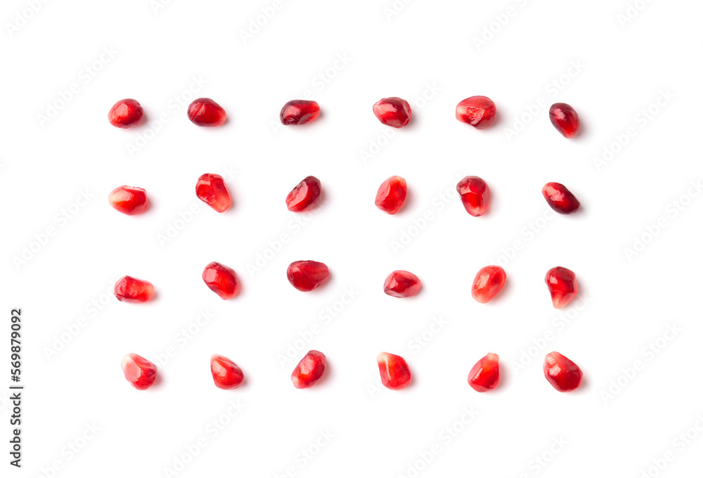 Pomegranate seeds are neatly arranged on a white background top view. Pomegranate seeds are neatly arranged on a white background top view.