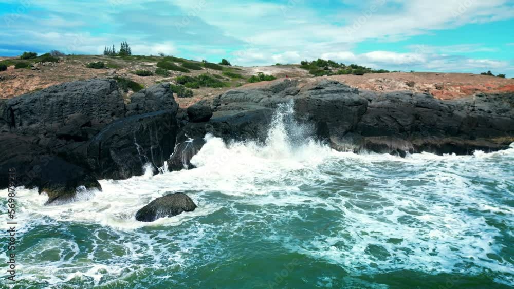 Ocean Waves Crashing Against Rocks And Cliffs , Large Ocean Beautiful Wave, Awesome power of waves breaking over dangerous rocks. sea waves vietnam coast view. Sea waves, Mui Ne, Vietnam. Asia. 4K Ocean Waves Crashing Against Rocks And Cliffs , Large Ocean Beautiful Wave, Awesome power of waves breaking over dangerous rocks. sea waves vietnam coast view. Sea waves, Mui Ne, Vietnam. Asia. 4K