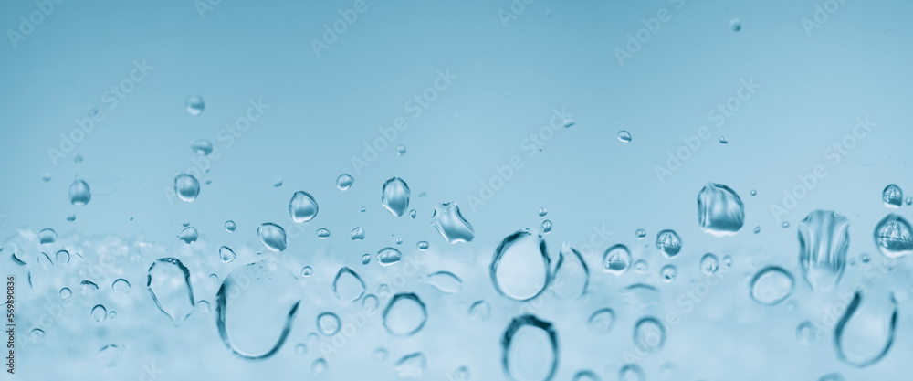 Minimal light backdrop with rain droplets on white glass. Light wet window with rainy drops closeup in blue light. Blurry minimalist monochrome background of window glass with raindrops close up. Minimal light backdrop with rain droplets on white glass. Light wet window with rainy drops closeup in blue light. Blurry minimalist monochrome background of window glass with raindrops close up.