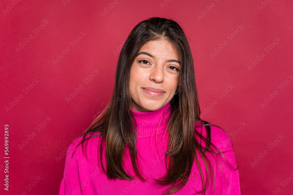 Smiling young woman looking at camera and looking at camera Smiling young woman looking at camera and looking at camera