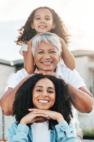 Portrait of happy family child, mother and grandmother bonding, smile and enjoy quality summer time together. Love, outdoor sunshine and generation face of people on vacation in Rio de Janeiro Brazil #569894091