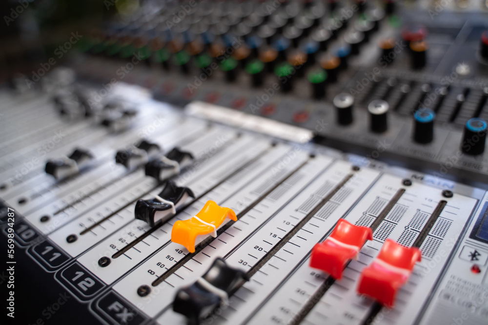 Close-up of the music mixer control panel. colorful buttons