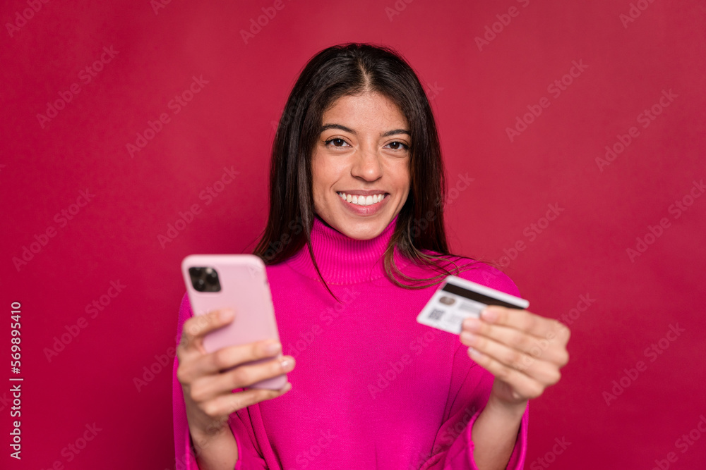 Excited woman with smartphone and credit card Excited woman with smartphone and credit card
