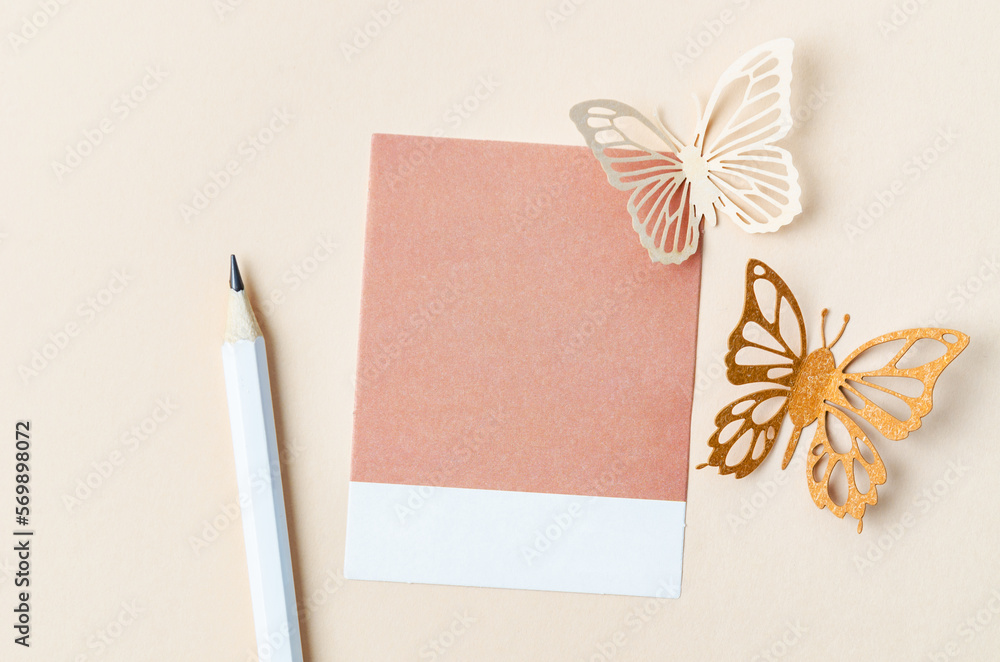 The Blank reminder note and carve of paper butterfly with pencil on yellow background, space for text. The Blank reminder note and carve of paper butterfly with pencil on yellow background, space for text.