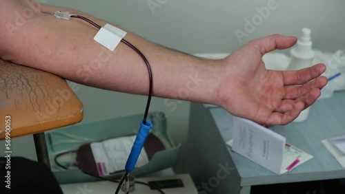 4k clip with the hand of a blood donor donating blood in a hospital