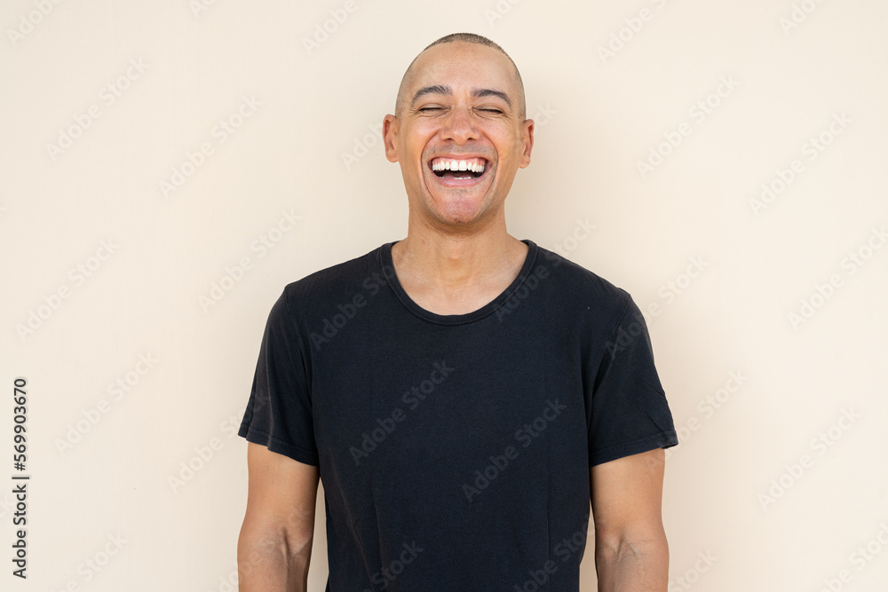 Portrait of handsome bald man laughing Portrait of handsome bald man laughing