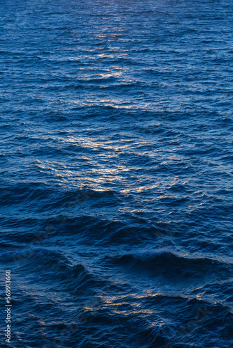 Surface of the sea during sunset © ptyszku