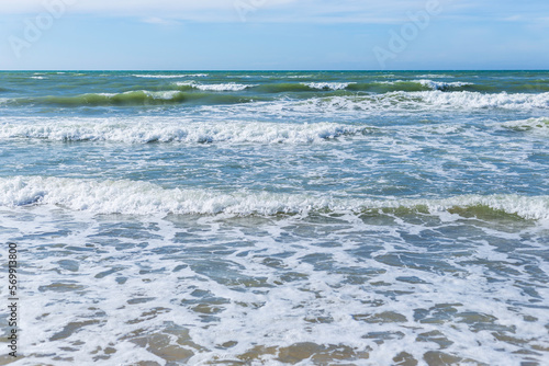 Ocean waves on a sandy beach